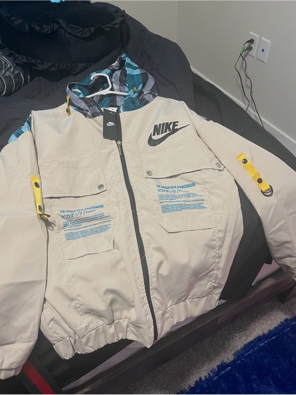 Nike Cream Hooded Jacket with Blue Camouflage Lining and Yellow Strap Accents